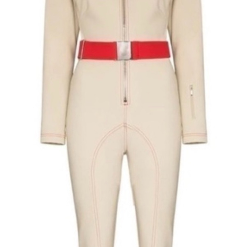 CORDOVA LES ARCS BELTED SKI SUIT IN Beige with Red Belt and red stitching.
